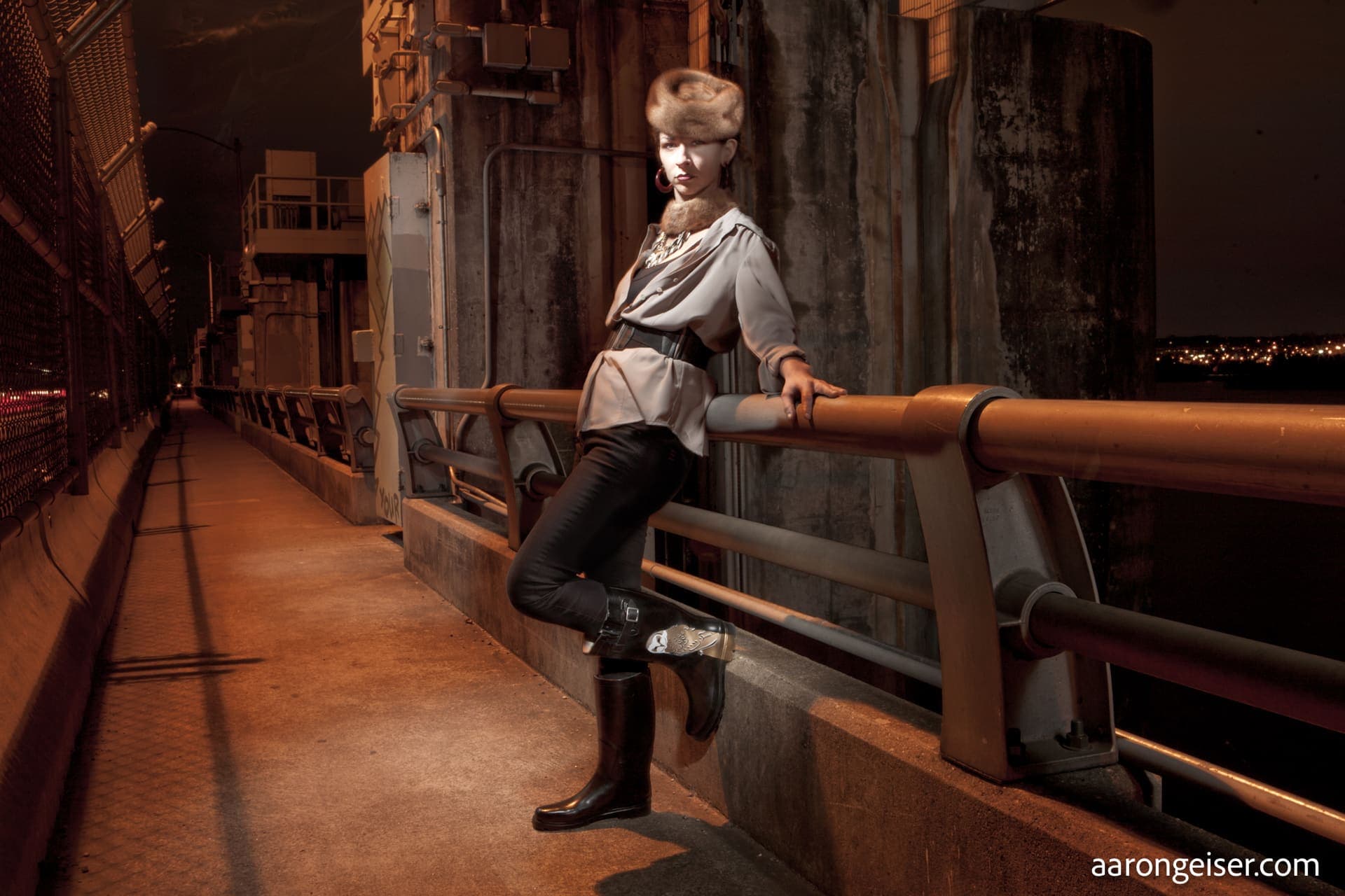 Dominique Vyborny on a bridge walkway at night in Austin, Texas.